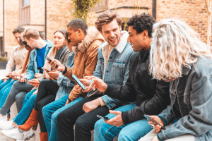 A group of people on phones sat together