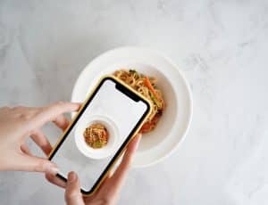 Influencer women who take a food photo with her Phone