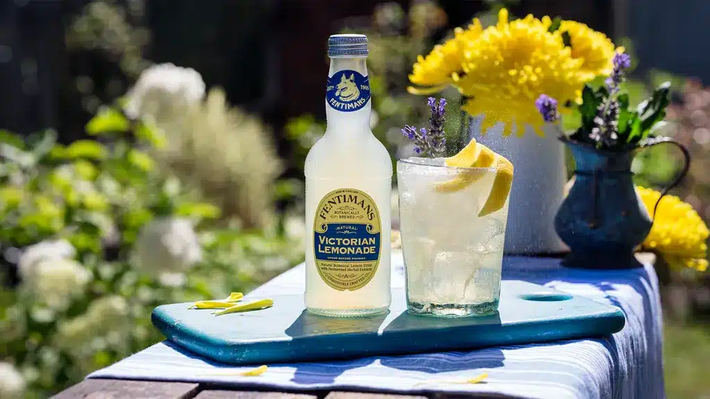 Fentimans Victorian lemonade served outdoors with flowers