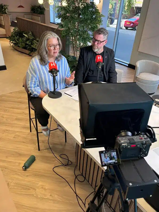 Huthwaite's podcast hosts in conversation on set