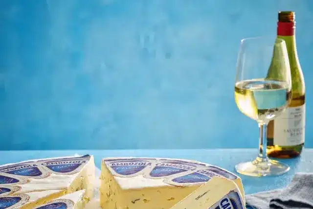 Cheese Artistry UK cheese with a glass of white wine
